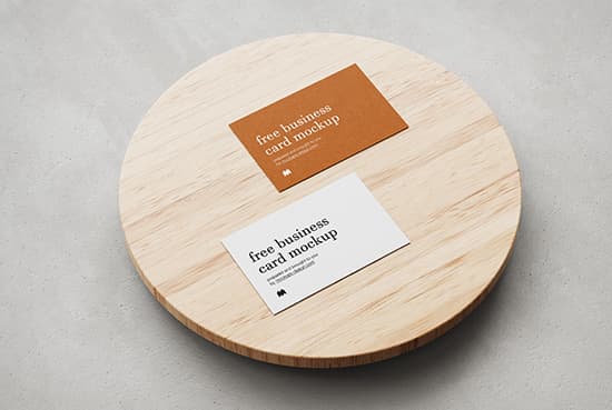 Business cards on wooden plate
