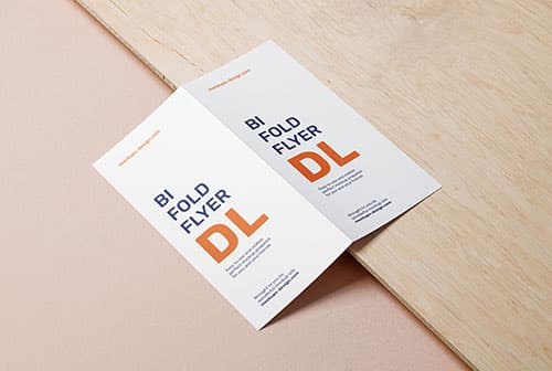 Bifold DL flyer on wooden board mockup