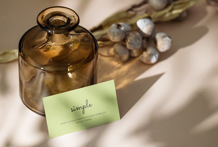 Business card with dark bottle mockup