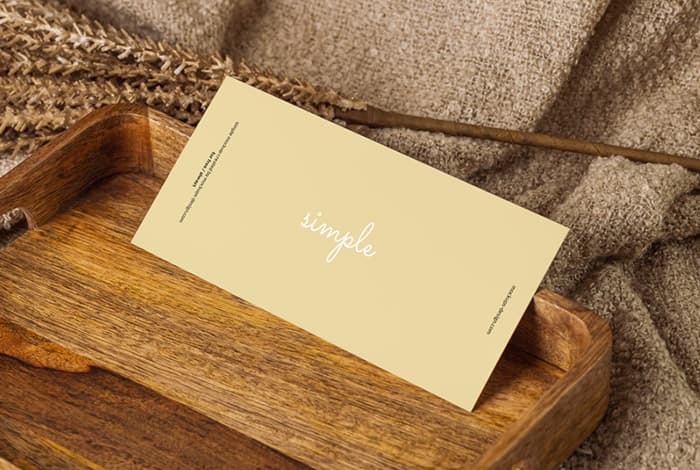 Horizontal DL flyer in wooden tray mockup