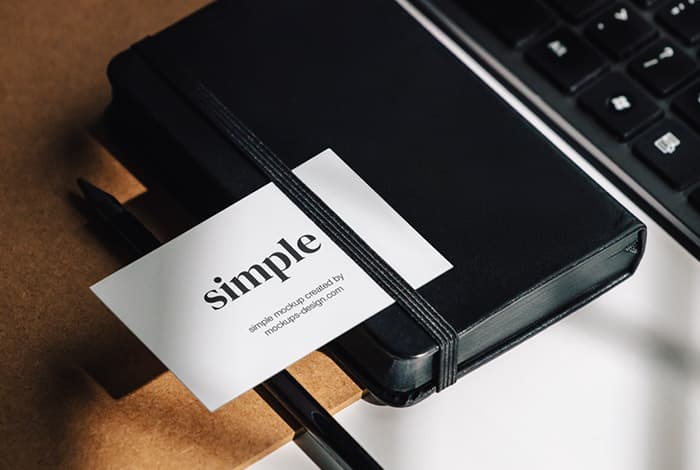 Business card on the black notepad