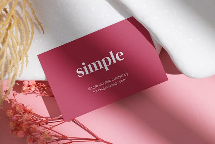 Business card on white stones mockup