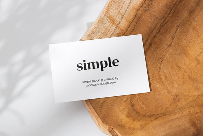 Business card on a slice of wood mockup