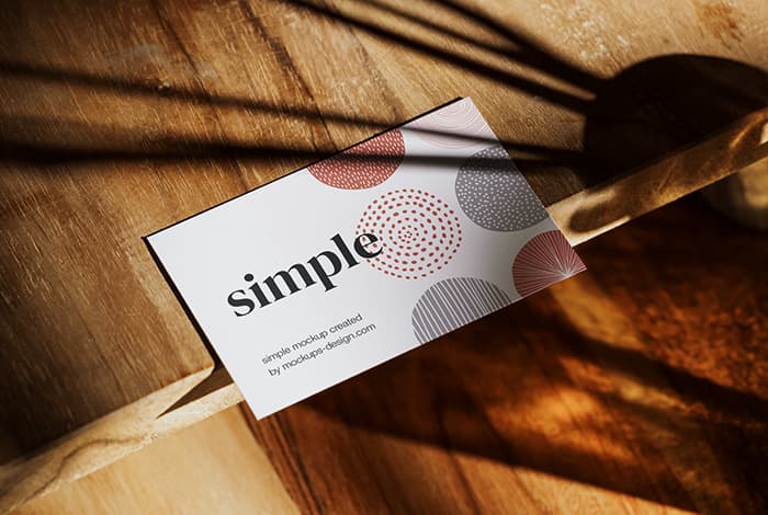 Business card on wooden table mockup