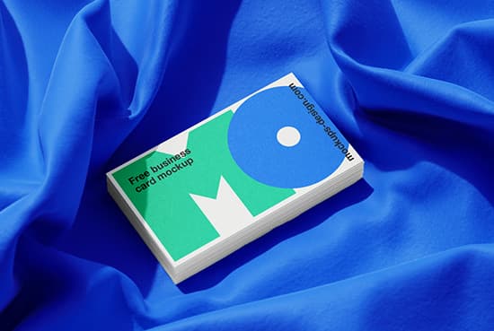Business cards lying on a fabric mockup